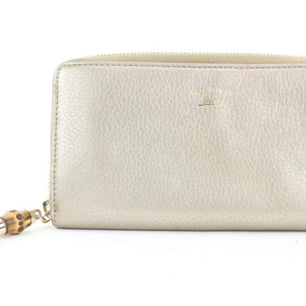 Gucci Gold Leather Bamboo Tassel Zip Around